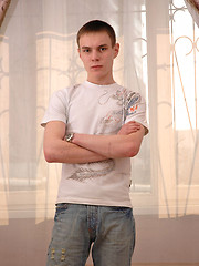Twink grabs his crotch and poses for the camera